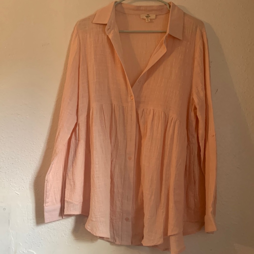 Size large Pink button up top. Never worn.